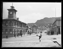 black and white image of Norwich Quay  in Lyttelton looking west including the post office and canterbury hotel