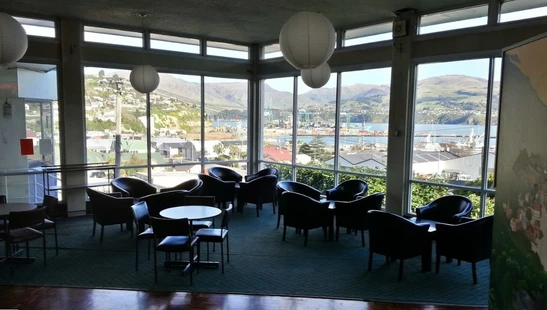 chairs and tables within the Lyttelton top club over looking Lyttelton harbour