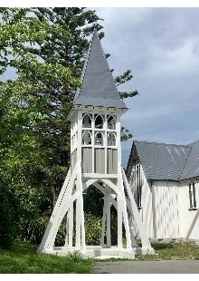 white wooden bell tower outside St saviours church at holy trinity lyttelton