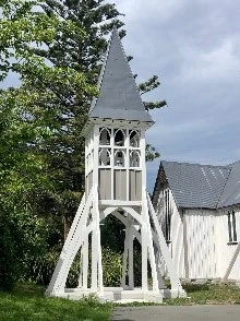 white wooden bell tower outside St saviours church at holy trinity lyttelton