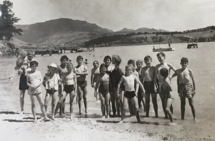 Black and white photograph of children on Corsair bay in Lyttelton Harbour