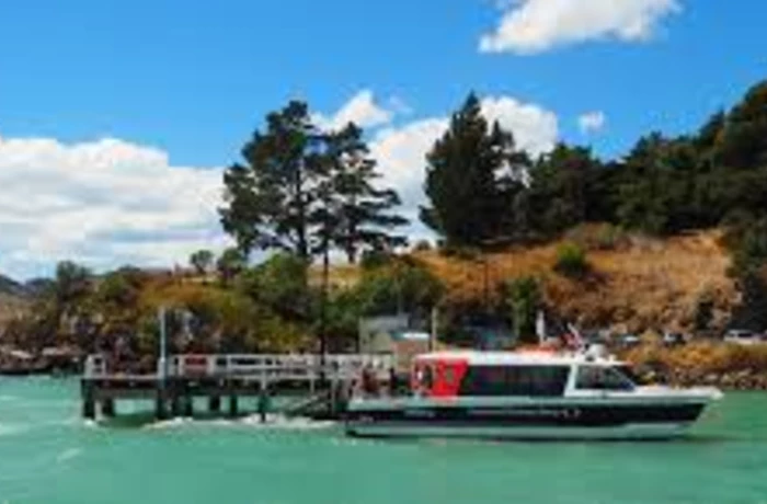 Black cat ferry in front of the diamond Harbour Pier in lyttelton Harbour