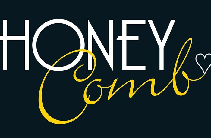 white and gold writing of Honey Comb hair salon in lYttelton