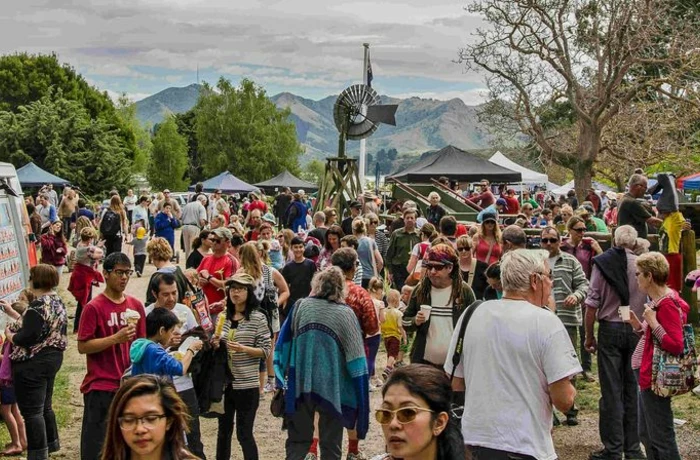 crowds of people walking through Orton Bradley Park